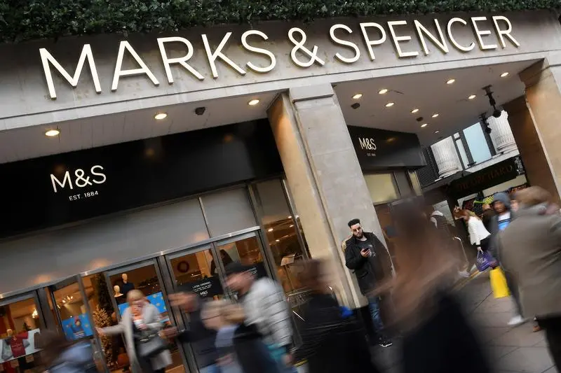 Image for illustrative purpose.\\r\\nShoppers walk past a branch of Marks and Spencer in central London, Britain, November 3, 2017. Picture taken November 3, 2017.  , Reuters Images/Toby Melville 