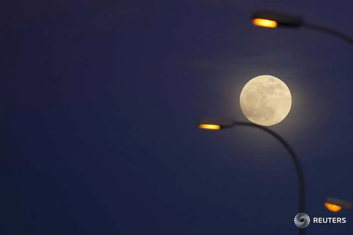 Image used for illustrative purpose.\\r\\nThe \\'supermoon\\' full moon is seen rising behind street lights in Ronda, southern Spain January 1, 2018. , Reuters Images/Jon Nazca 