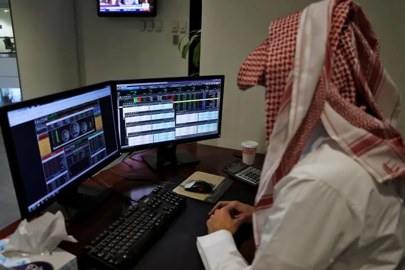 A Saudi trader observes the stock market on monitors at Falcom stock exchange agency in Riyadh, Saudi Arabia February 7, 2018. Reuters, Faisal Al Nasser