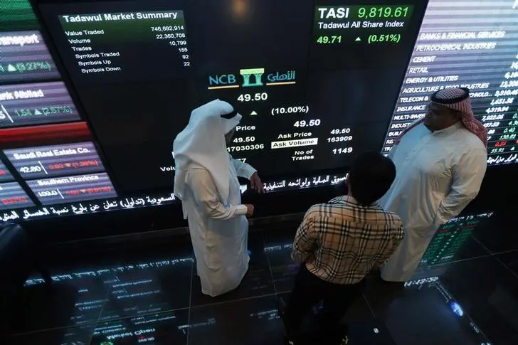 Investors monitor screens displaying stock information at the Saudi Stock Exchange (Tadawul) in Riyadh November 12, 2014. , Reuters/Faisal Al Nasser 