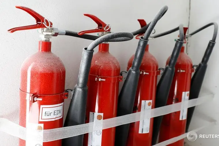 Fire-extinguishers are seen at the HydroMiner cryptocurrency farming operation near Waidhofen an der Ybbs, Austria April 25, 2018.  \\r\\nImage used for illustrative purposes. , Reuters Images/Leonhard Foeger
