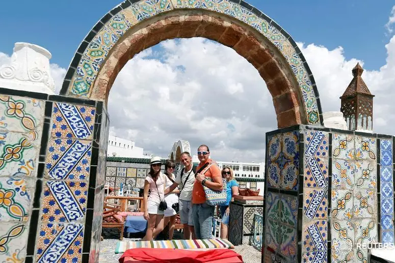 Russian tourists are seen on a terrace at the Medina (Old Town) of Tunis, Tunisia June 27, 2018.   , Reuters Images/Zoubeir Souissi 