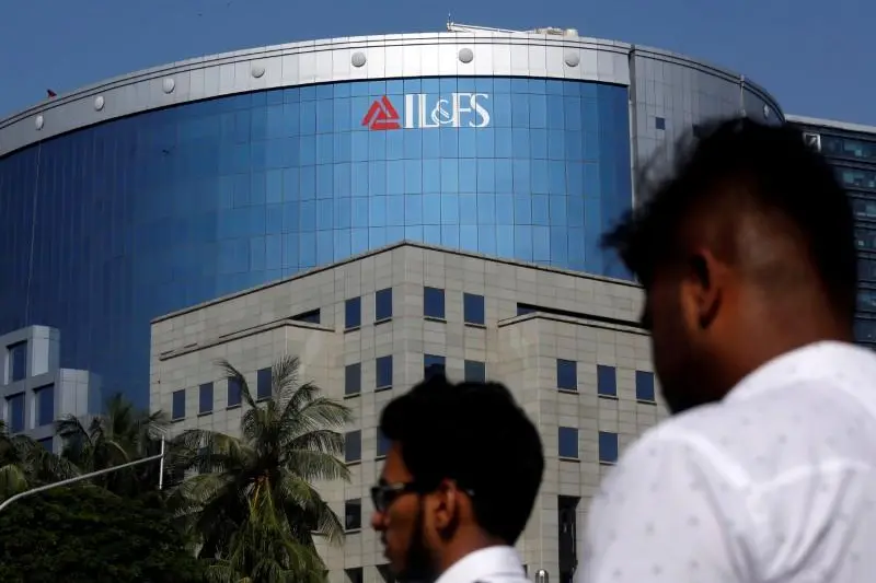 People walk past a building of IL&FS (Infrastructure Leasing and Financial Services Ltd.) outside its headquarters in Mumbai, India, September 25, 2018.  , Reuters Images/Francis Mascarenhas