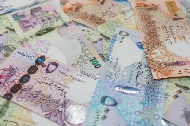 High Angle View Of Qatar Currencies. Image used for illustrative purpose. Getty Images/EyeEm