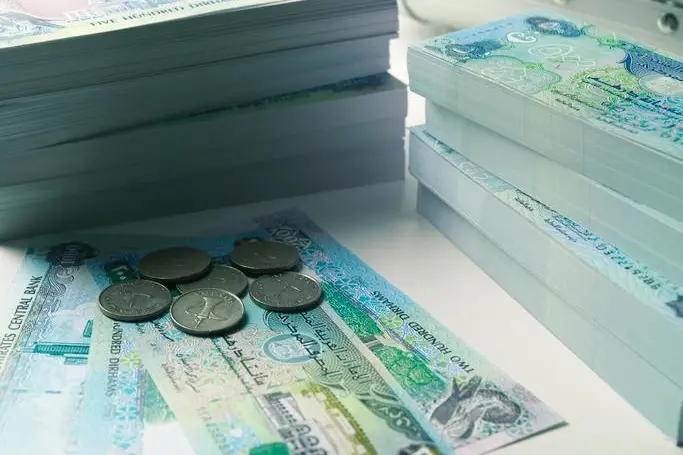 Bundle of Arab Money. Getty Images/Gulf Images RF