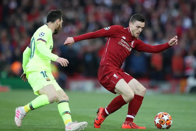 Soccer Football - Champions League Semi Final Second Leg - Liverpool v FC Barcelona - Anfield, Liverpool, Britain - May 7, 2019  Liverpool\\'s Andrew Robertson in action with Barcelona\\'s Lionel Messi          , Reuters Images/Carl Recine 