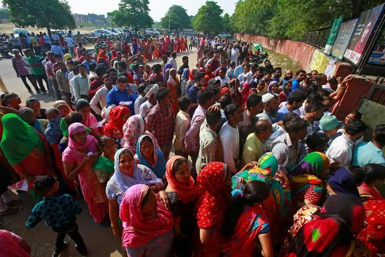 Voters stand in queues as they wait to cast their vote outside a polling station during the final phase of general election in Chandigarh, India, May 19, 2019.  , Reuters Images/Ajay Verma