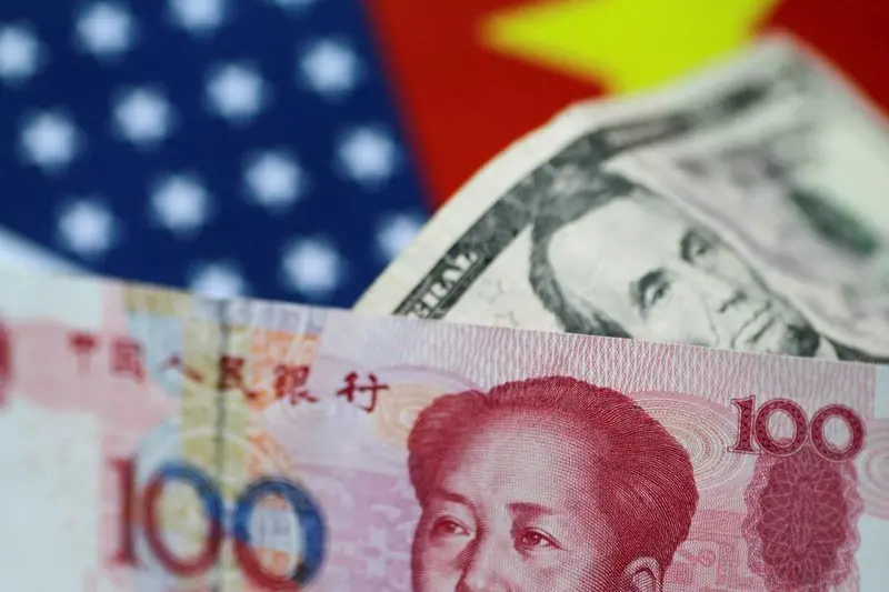 U.S. dollar and China yuan notes are seen in this picture illustration June 2, 2017. Image used for illustrative purpose. , Thomas White