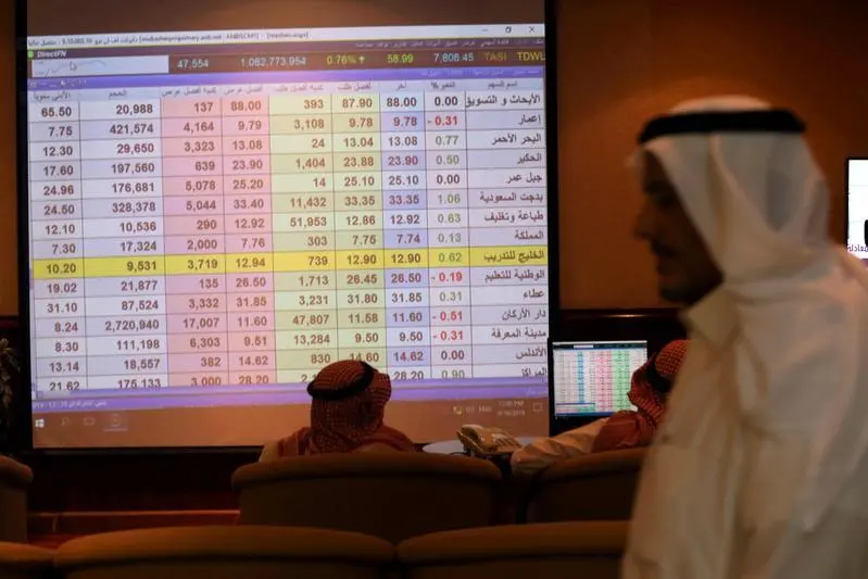 Saudi men inspect a screen showing stock prices at ANB Bank in Riyadh, Saudi Arabia September 16, 2019. Image for illustrative purposes.Ahmed Yosri
