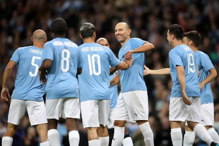 Soccer Football - Vincent Kompany\\'s Testimonial - Manchester City Legends v Premier League All-Stars - Etihad Stadium, Manchester, Britain - September 11, 2019   Manchester City Legends\\' Martin Petrov celebrates scoring their first goal with team mates. , Reuters Images/Carl Recine