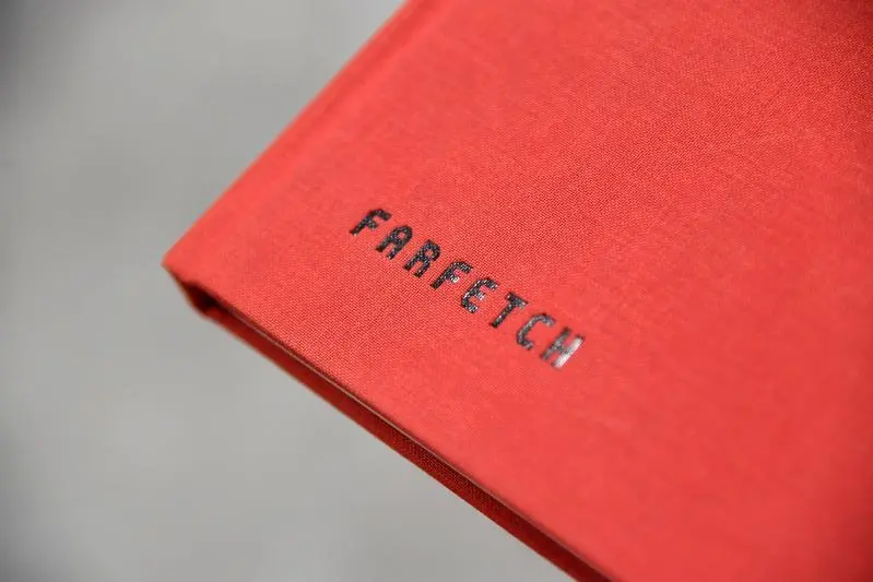 Branding for online fashion house Farfetch is seen at the company headquarters in London, Britain January 31, 2018. , Reuters Images/Toby Melville 