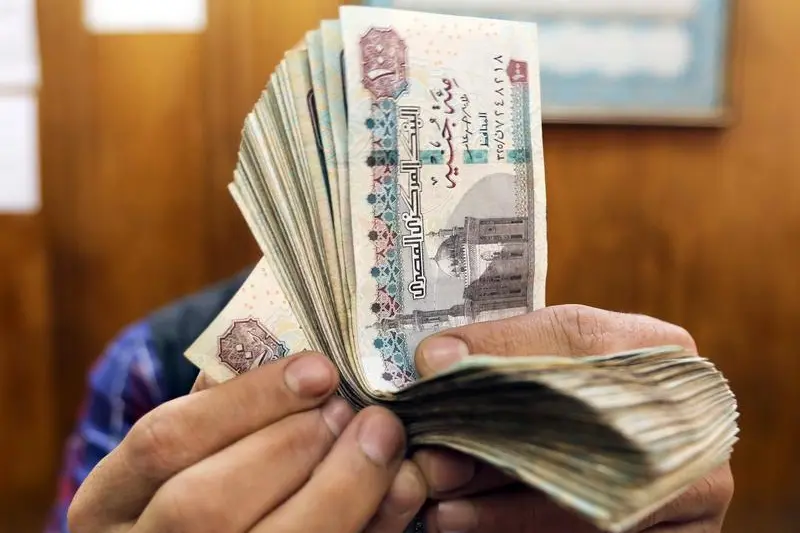 An employee counts Egyptian pounds at a foreign exchange office in central Cairo, Egypt, March 20, 2019. Image used for illustrative purpose. Mohamed Abd El Ghany