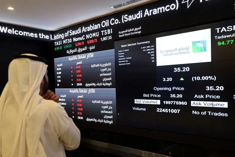 Image used for illustrative purpose. An investor monitors a screen displaying stock information at the Saudi Stock Exchange (Tadawul) following the debut of Saudi Aramco\\'s initial public offering (IPO) on the Riyadh\\'s stock market, in Riyadh, Saudi Arabia, December 11, 2019. Ahmed Yosri