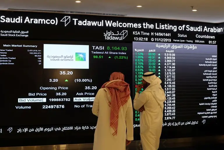 Image used for illustrative purpose Investors monitor a screen displaying stock information at the Saudi Stock Exchange (Tadawul) following the debut of Saudi Aramco\\'s initial public offering (IPO) on the Riyadh\\'s stock market, in Riyadh, Saudi Arabia, December 11, 2019.