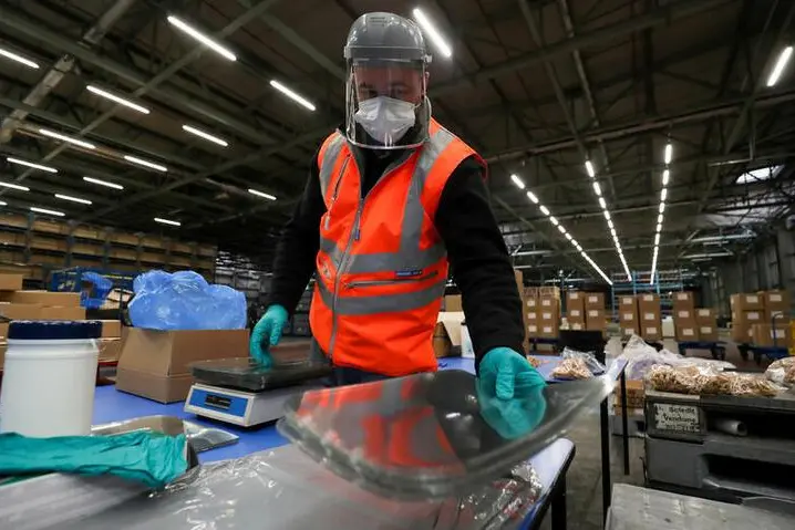 An employee works at the Nissan plant, as Nissan produces visors for the NHS, amid the outbreak of the coronavirus disease (COVID-19), in Sunderland, Britain, April 21, 2020.  , Reuters Images/Lee Smith     