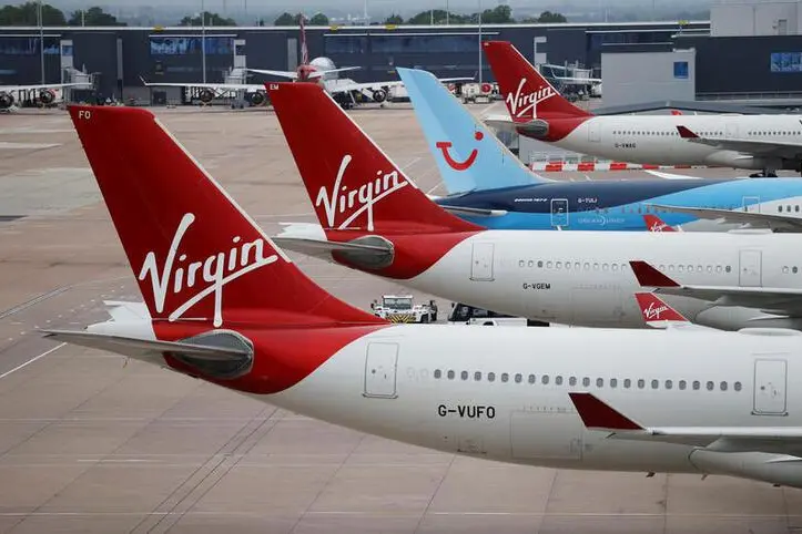 Virgin Atlantic and TUI Airways aircraft are seen at Manchester Airport, following the outbreak of the coronavirus disease (COVID-19), Manchester, Britain, June 8, 2020.  , Reuters Images/Phil Noble
