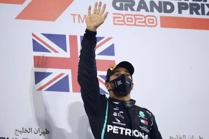 Formula One F1 - Bahrain Grand Prix - Bahrain International Circuit, Sakhir, Bahrain - November 29, 2020 Mercedes\\' Lewis Hamilton celebrates on the podium after winning the race. , Reuters Images/Bryn Lennon