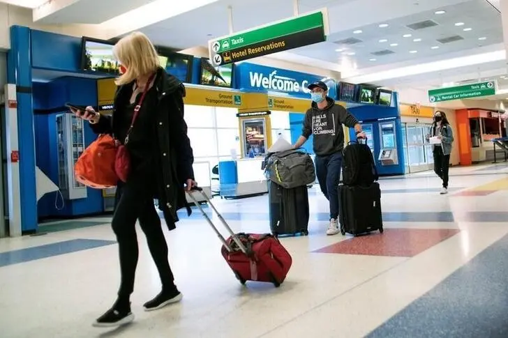 Passengers arrive on a flight from London amid new restrictions to prevent the spread of coronavirus disease (COVID-19) at JFK International Airport in New York City, U.S., December 21, 2020.  , Reuters Images/Eduardo Munoz