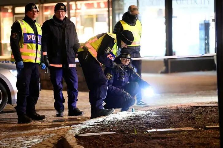 Police forensics team members work at a knife attack site where several people were injured before the suspect was shot by police and taken into custody in Vetlanda, Sweden March 3, 2021. TT News Agency/Mikael Fritzon via REUTERS 