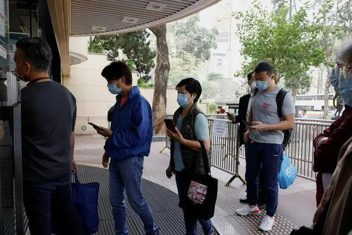 People queue up at a community vaccination centre to receive a dose of the Sinovac Biotech coronavirus disease (COVID-19) vaccine, in Hong Kong, China, February 26, 2021.  , Reuters Images/Tyrone Siu
