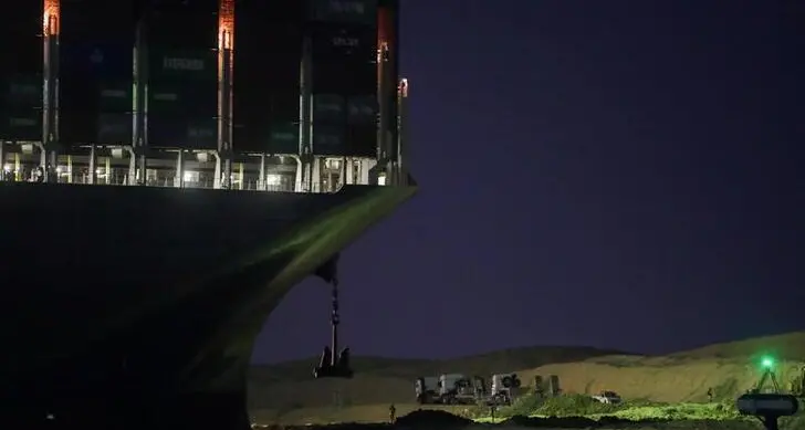 Tugs, dredgers still struggle to free ship blocking Suez Canal