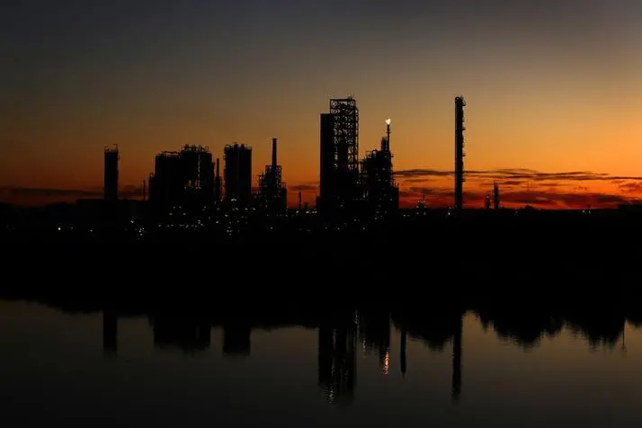 The sun sets behind Shell\\'s Clyde refinery in Sydney July 17, 2012.  , Reuters Images/Tim Wimborne 