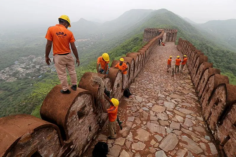 Members of the State Disaster Response Force (SDRF) conduct a search operation following a lightning strike at a watch tower near Amer Fort in Jaipur in the desert state of Rajasthan, India, July 12, 2021.  , Reuters Images/Stringer 