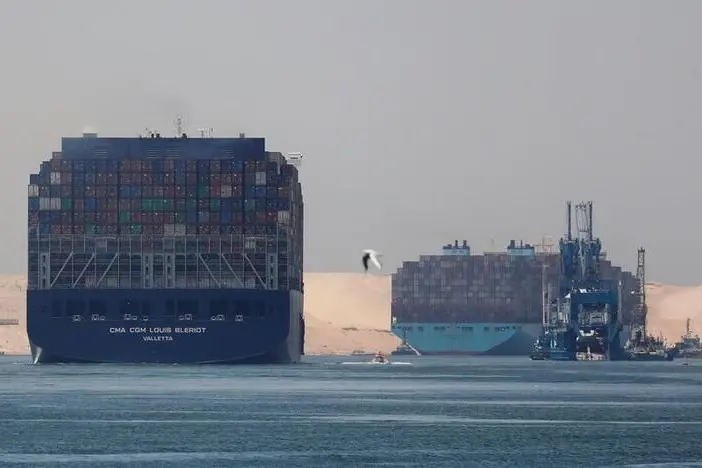 CMA CGM Louis Bleriot and a Maersk Line container ship pass through the Suez Canal in Ismailia, Egypt July 7, 2021.  , Reuters Images/Amr Abdallah Dalsh