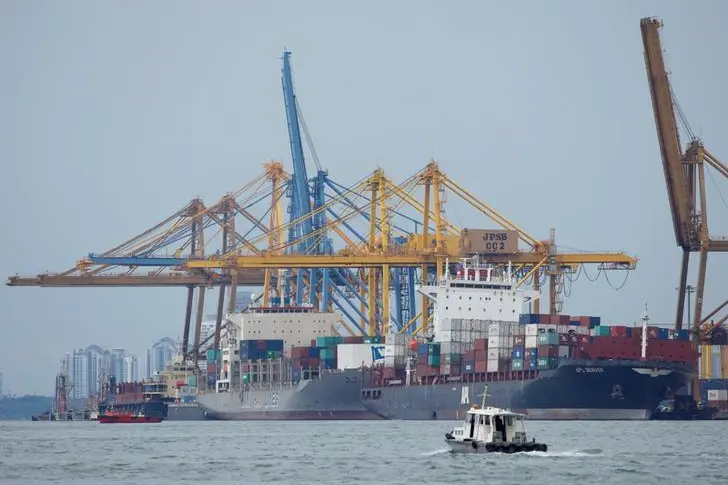 Container vessels APL Denver (R) and Wan Hai 301 are docked at Johor\\'s Pasir Gudang Port after their collision in the waters between Malaysia and Singapore, January 4, 2017.   , Reuters Images/Edgar Su