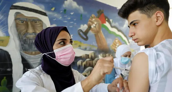 COVID-19 vaccine mandates - and prizes - boost uptake among Palestinians