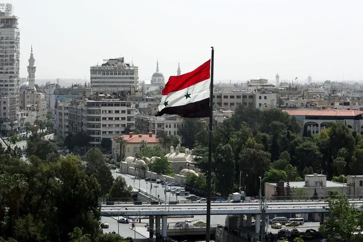 A Syrian flag flutters in Damascus, Syria April 20, 2018. Ali Hashisho. REUTERS