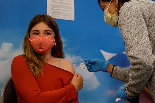 Image used for illustrative purpose. Eleven year-old Victoria Stout receives the Pfizer-BioNTech coronavirus vaccine at Rady\\'s Children\\'s hospital vaccination clinic in San Diego, California, U.S., November 3, 2021.   , Reuters Images/Mike Blake